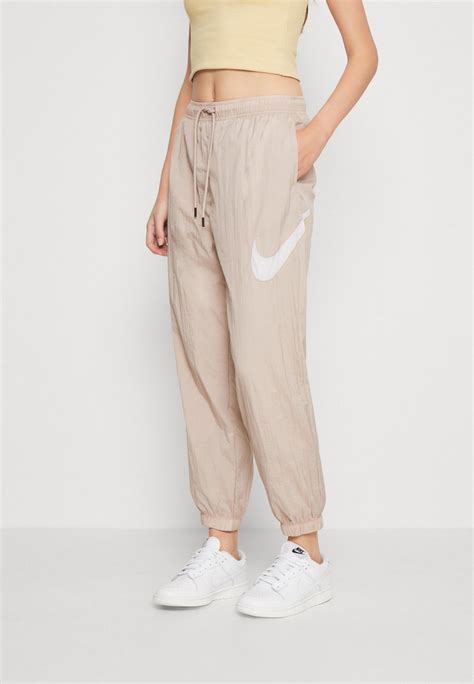 nike hose mit knöpfen an der seite damen|nike jogginghose beige damen.